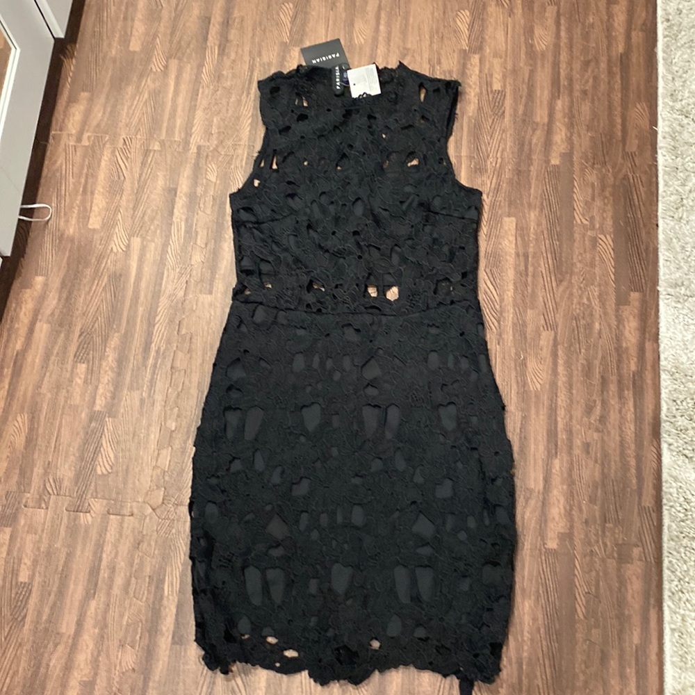 Black lace dress with cutouts. Lined bodice and bottom skirt section. SZ Us 8